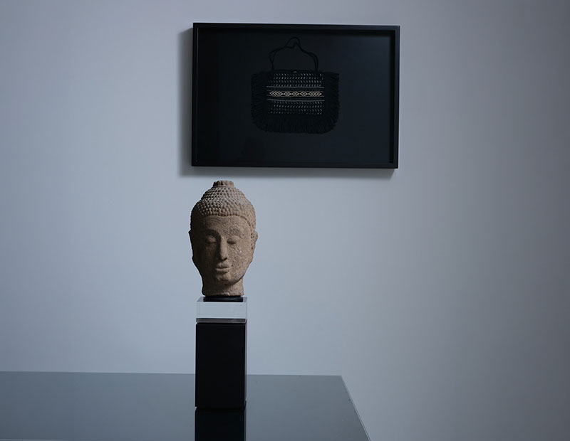 Alexis Neal Kete and Carved Buddha Head.